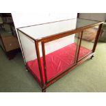 Early C20th mahogany shop keepers display case with  two sliding doors, 153 W