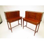 A pair of Edwardian Sheraton revival Bonheur du jours, each inlaid with swags and urns. and having a