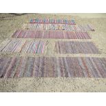 Five assorted hand stitched woollen rugs