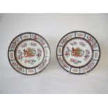 Pair of Samson porcelain Armorial plates polychrome enamelled and centred by an elaborate crest