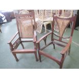 Two arts and crafts oak open arm elbow chairs