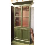 Green painted display cabinet fitted two glazed doors over two cupboard base, 199cm H