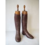 Pair brown leather riding boots by Peal & Co of London, and wooden trees