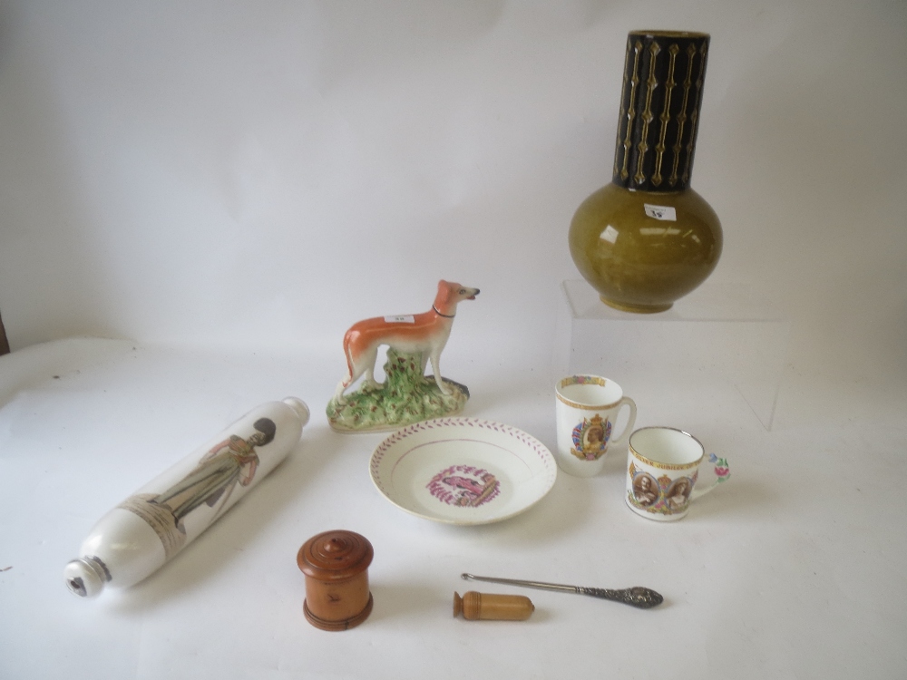 C19th Staffordshire greyhound with flattened head a Victorian 'End of Day' glass rolling pin with