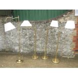 Two pairs of adjustable brass standard lamps with cream shades