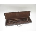 Single leather gun case with cleaning rods and glass oil bottle and "Bamboo and cane 3 piece