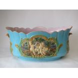 Large Minton style majolica jardiniere with Bachanalian figures in raised relief 58W