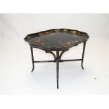 Regency black lacquered tray on later stand with gilt decoration