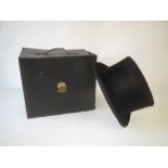 Gentleman's black faux top hat by MOSS BROS with cardboard hat box, size approx size 7 1/4.   6 1/2"