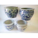 4 blue and white pots and planters