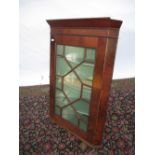 George III mahogany corner cabinet with astragal glazed door enclosing three shelves 77W