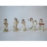 Set of five Neapolitan musical cherub figures 12cm H. 
The cherubs have slight chips for the wings