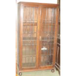 1920's oak display bookcase cabinet fitted two doors enclosing shelves, 92cm W