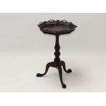 C20th carved mahogany tripod table in the Chippendale taste with fret work with scrolling legs to