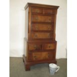 Reproduction mahogany chest on chest of small proportions on bracket feet, 76cm H