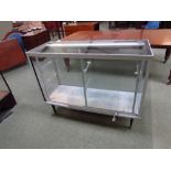 Five sided glass shop keepers display case with shelving 121W