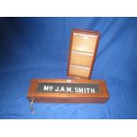 Oak cased revolving name sign 18cm high x 69cm long.  Don Garcia mahogany display case 50cm high x