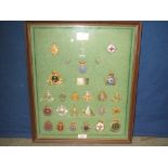 Presentation montage of 26 military cap badges from the officers of the 1st Canadian Signals