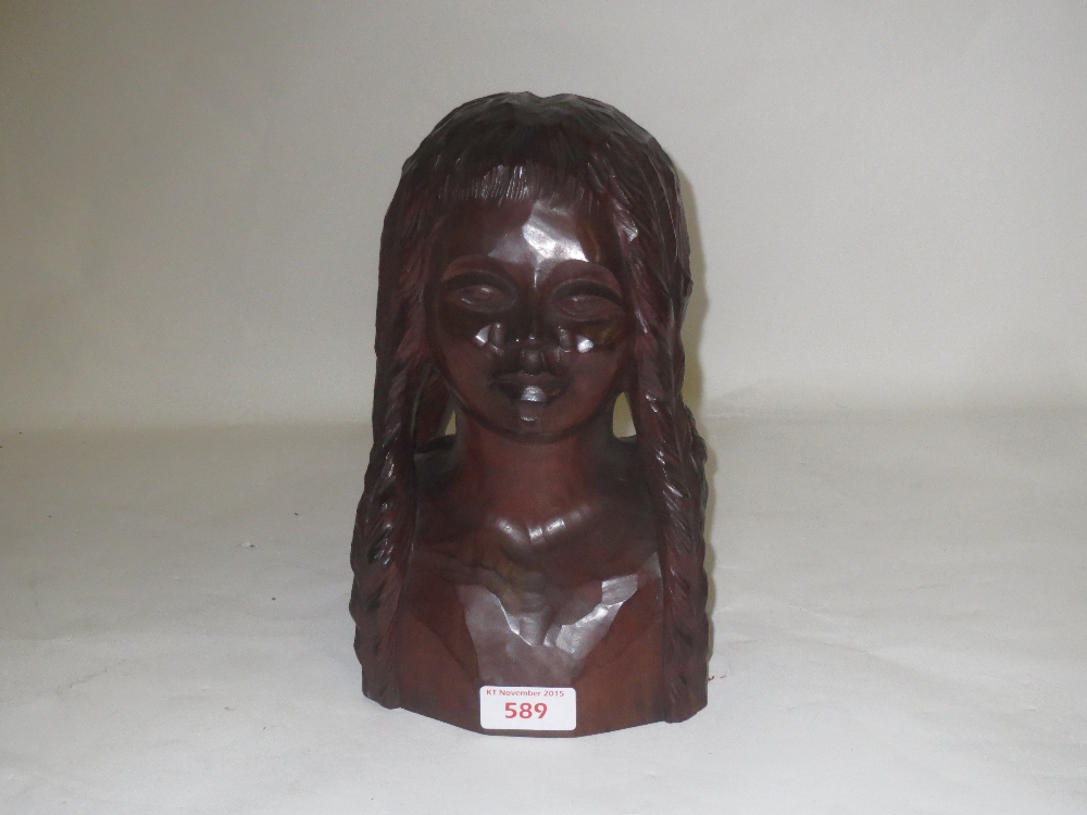 Manner of Paul Gauguin, hardwood sculpture of a maiden, her hair braided in four long tresses,