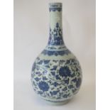 Chinese onion shaped narrow neck vase with blue and white floral decoration, 40cm H no obvious