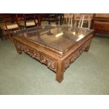 Chinese hardwood glass top low table with open fretwork frieze, 101cm x 106cm, 45cm high