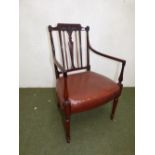 Late C20th mahogany open arm elbow chair, with Prince of Wales plume back , tanned leather seat on