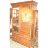 Late C19th pitch pine wardrobe in the Aesthetic taste,  with an arrangement of doors and drawers