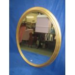 Giltwood oval wall mirror 117 cm