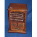Edwardian oak smokers Cabinet with glazed door enclosing three drawers