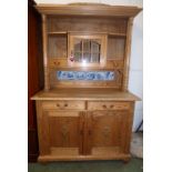 Modern pine dresser inset with 'Delft' tiles on a base with two drawers and cupboards, 125cm wide,