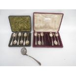 2 cased set of Hallmarked silver teaspoons and silver sugar sifter 8 ozt