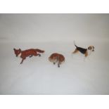 John Beswick model of a foxhound, large Beswick pottery fox and an Art Studio Pottery lying fox (3)