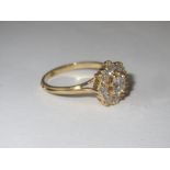 Yellow metal (tests C19ct) diamond round cluster ring (approx 1ct diamonds), size O