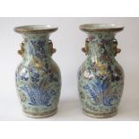 Pair of Chinese celadon glazed vases, polychrome enamelled , flanked by recumbent lion handles 34H