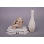 Chinese white-glazed long neck vase, 29.2cm high; together with a rectangular stand with a seated