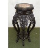 Chinese hardwood jardinière stand, the hexagonal marble inset top on pierced carved supports, 81cm