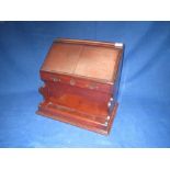Victorian table top stationery box fitted with  recesses for letters on a skirted base 39cm wide