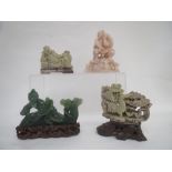 Three soapstone carvings, a jadeite carving on a stand (4)