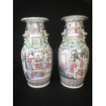 Pair of late C19th Chinese famille rose vases painted with scholarly figures amidst birds and