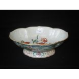 C18th Chinese famille vert footed dish, the exterior painted with panoramic landscape, the