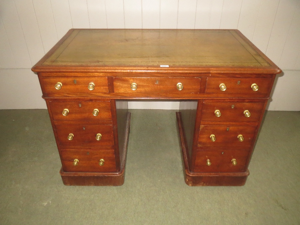 C19th mahogany pedestal desk of 9 drawers