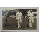 H.T. Hardinge and J.L. Bryan of Kent C.C.C. Mono real photograph postcard of the two players walking