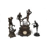 Belgian spelter clock garniture designed with figures of football. A complete three piece Belgian