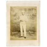 Edward Mills Grace. Large original sepia studio posed photograph of Grace in full cricket attire and