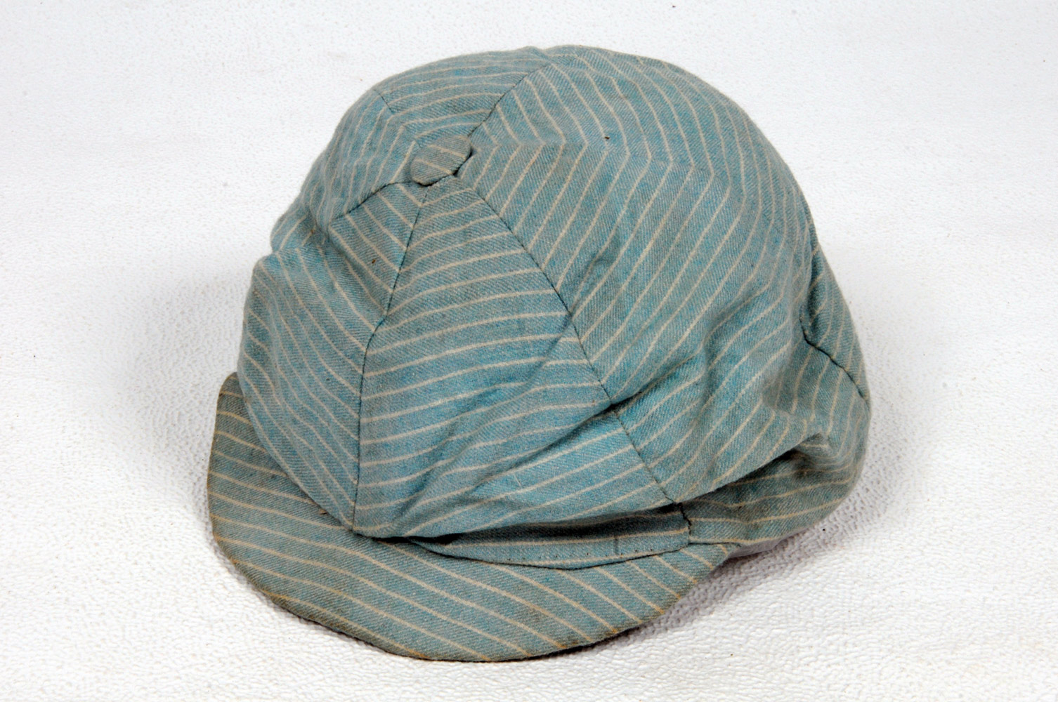 Edward Mills Grace. Original light blue pinstriped cloth cricket cap, apparently made by Mrs E.M.