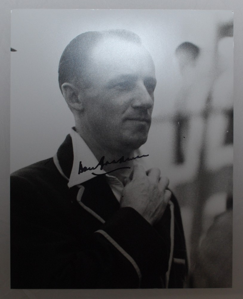 Don Bradman. Mono copy photograph of Bradman in Australian blazer. Nicely signed in later years by