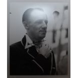 Don Bradman. Mono copy photograph of Bradman in Australian blazer. Nicely signed in later years by