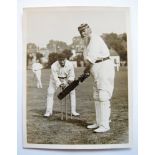 W.G. Grace. Original press photograph of W.G. Grace, wearing M.C.C. cap, posed at the wicket with