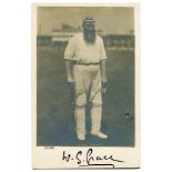 W.G. Grace. Mono real photograph postcard of Grace full length in batting attire wearing M.C.C.