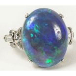 Ladies Vintage Black Opal, Platinum and Diamond Ring. The 7.32 Carat Center Stone with Lots of Fire,